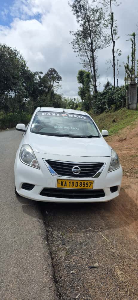 Nissan Sunny (KA 19D 8997) — East West Travels Manipal